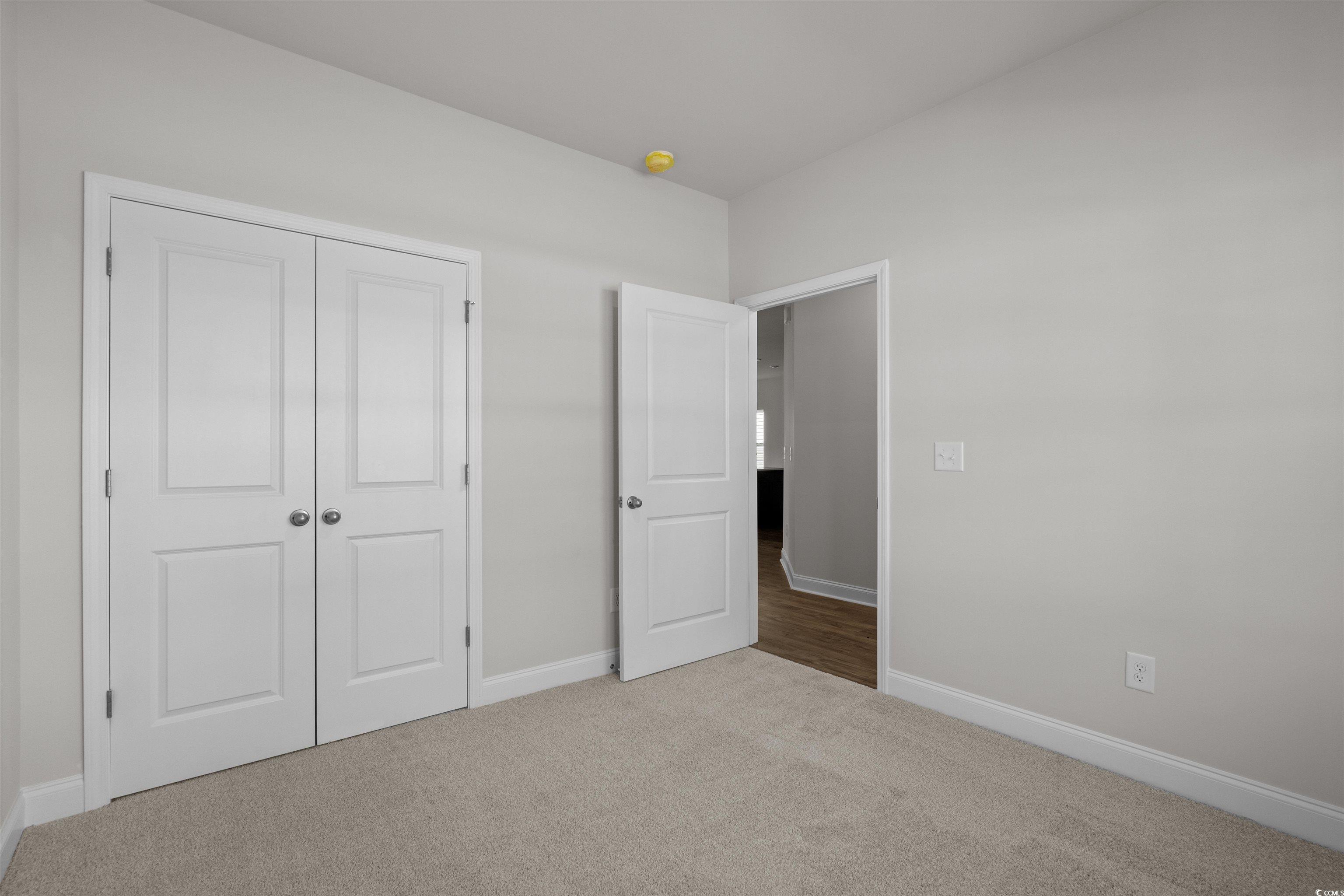 2494 Campton Loop Conway, SC 29527 - Photo 26 of 40 Unfurnished bedroom with carpet and a closet