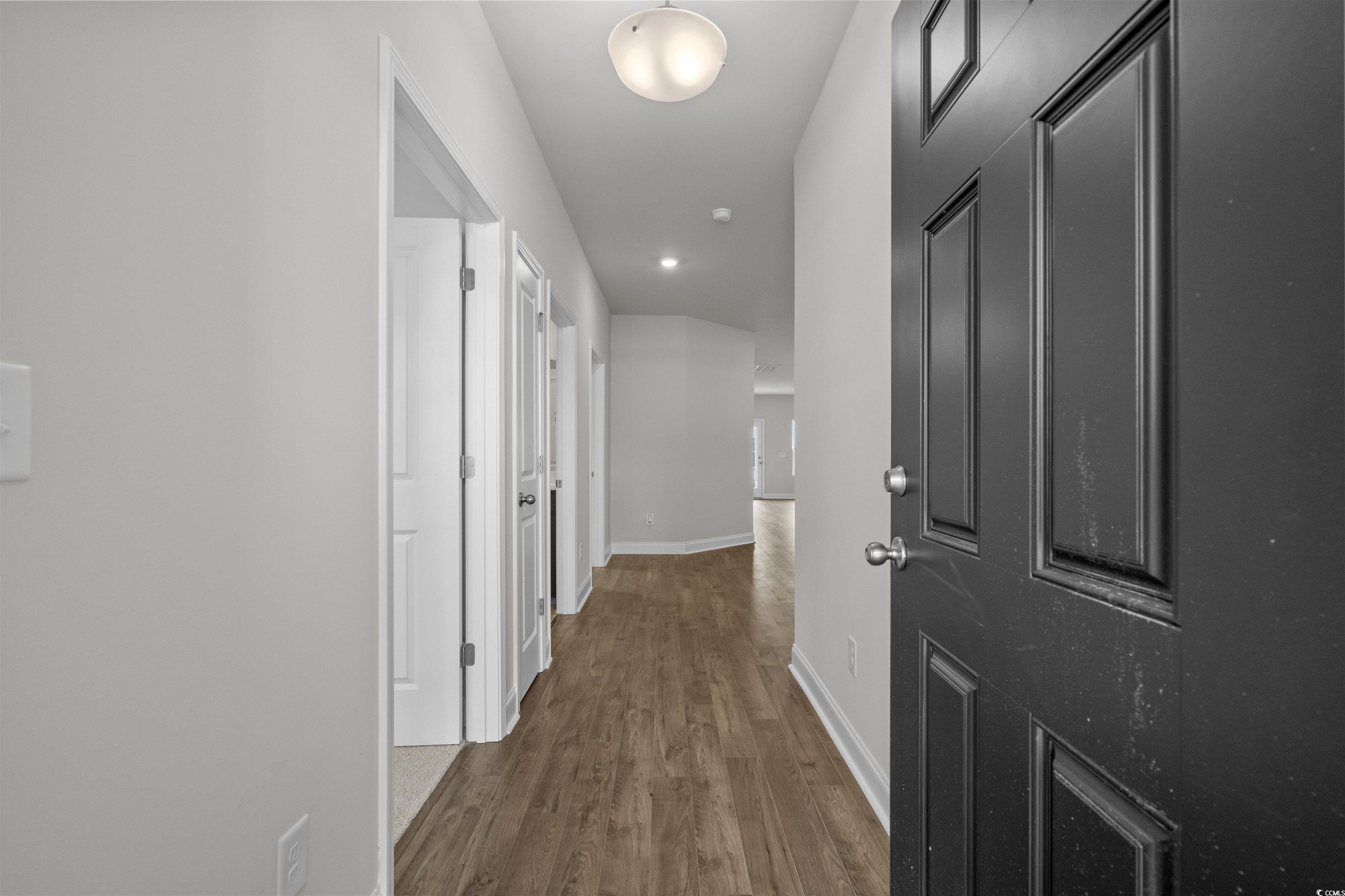 2494 Campton Loop Conway, SC 29527 - Photo 3 of 40 Hallway with dark wood-style flooring and recessed lighting