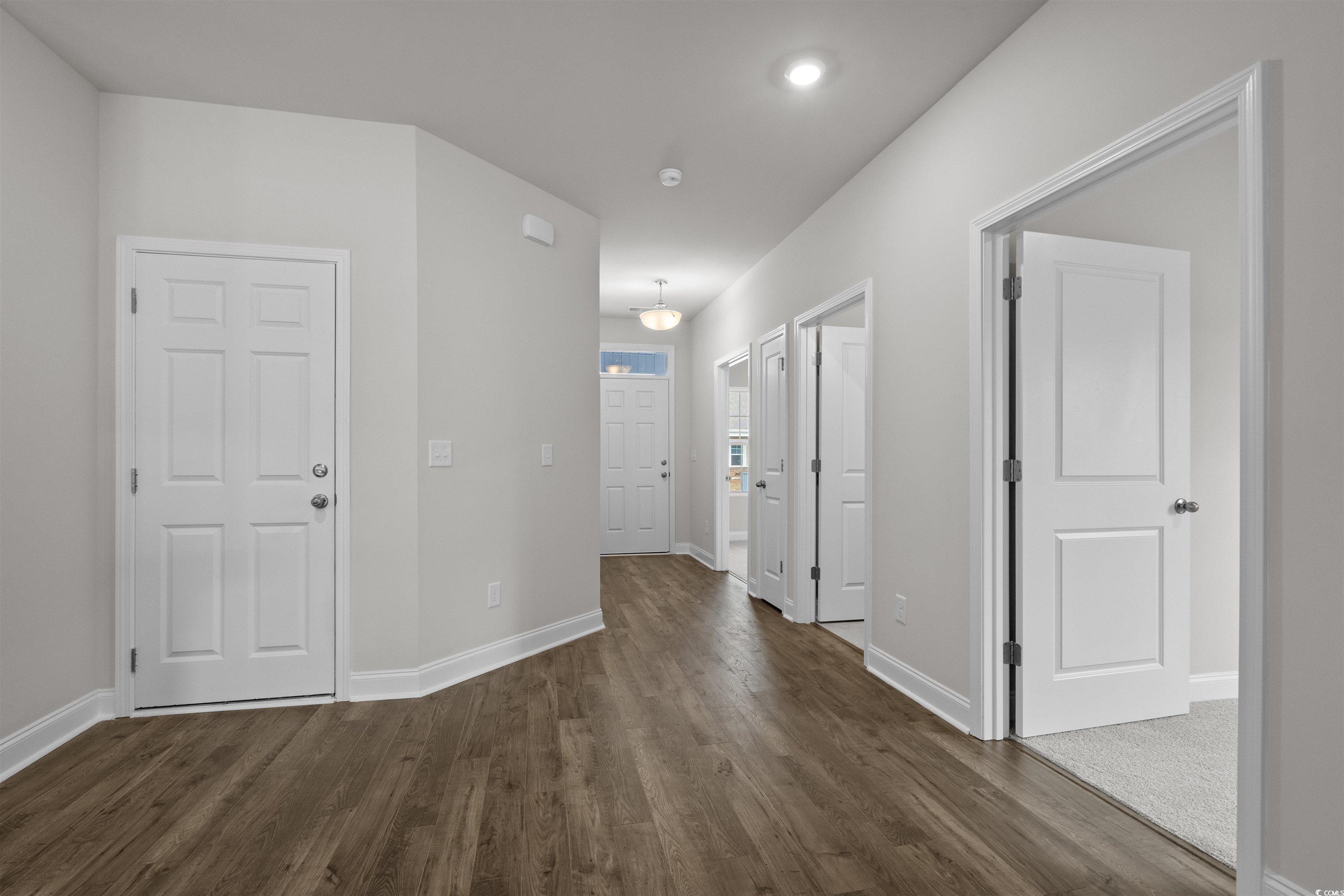 2494 Campton Loop Conway, SC 29527 - Photo 4 of 40 Corridor with baseboards and dark wood-type flooring