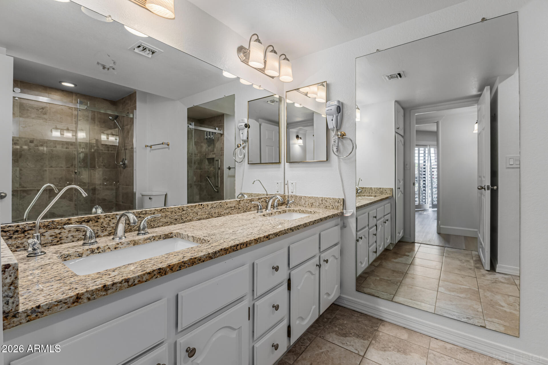 4303 East Cactus Road, Unit 126 Phoenix, AZ 85032 - Photo 15 of 31 a spacious bathroom with a granite countertop sink mirror and shower