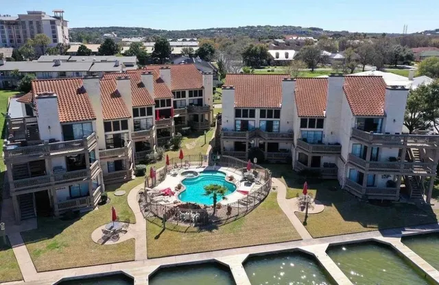 a view of multiple houses with outdoor space