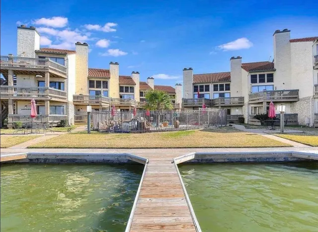 a swimming pool view with a outdoor seating space