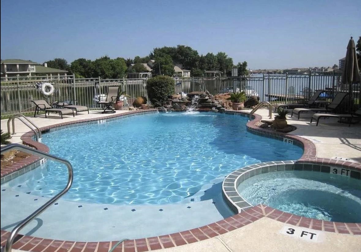 509 Short Circuit, Unit 108 Horseshoe Bay, TX 78657 - Photo 12 of 22 a view of a swimming pool with a lake view