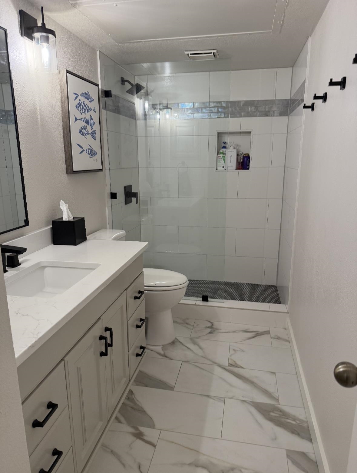 509 Short Circuit, Unit 108 Horseshoe Bay, TX 78657 - Photo 21 of 22 a bathroom with a sink toilet and shower