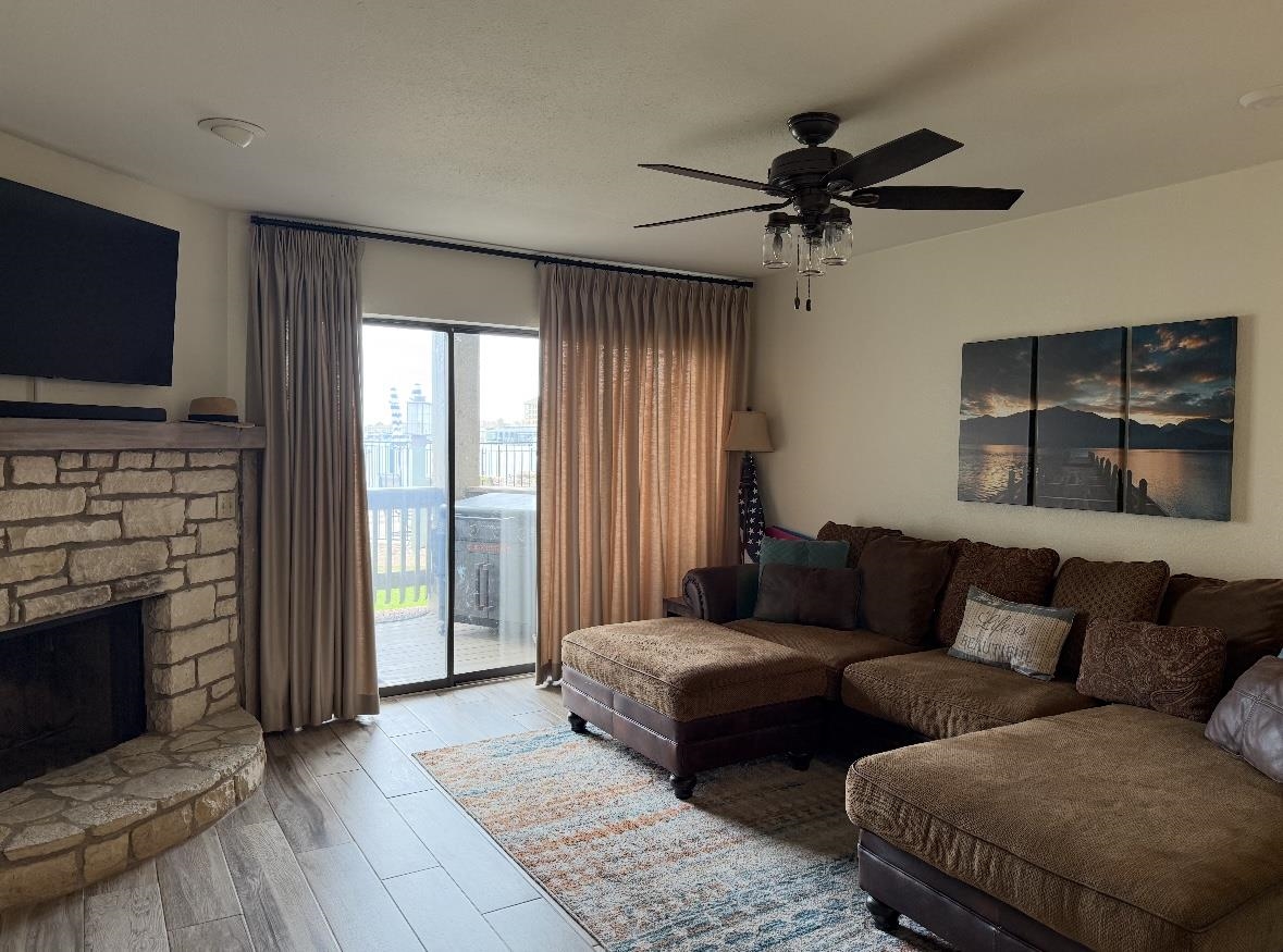 509 Short Circuit, Unit 108 Horseshoe Bay, TX 78657 - Photo 22 of 22 a living room with furniture and a flat screen tv