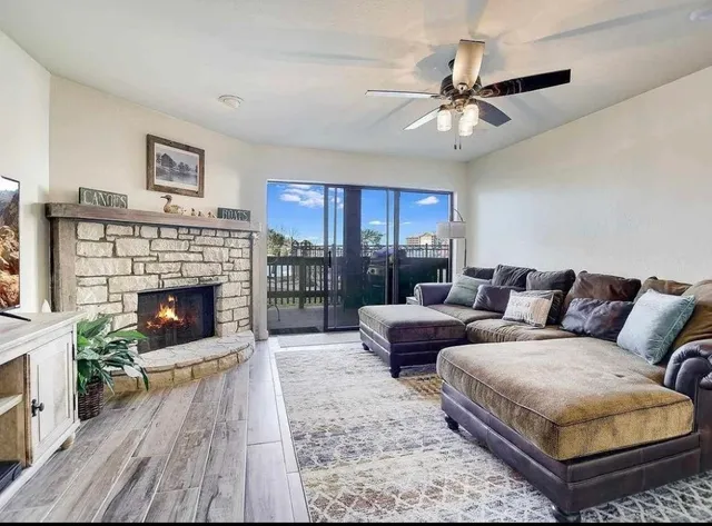 a living room with furniture and a fireplace