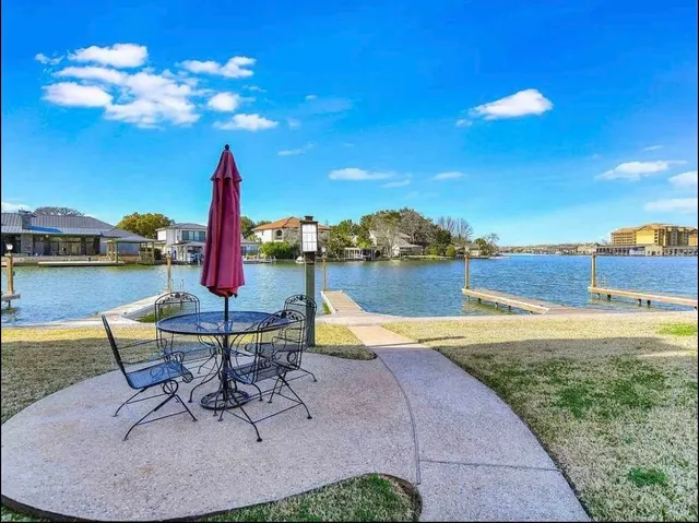 a view of a lake and a chairs