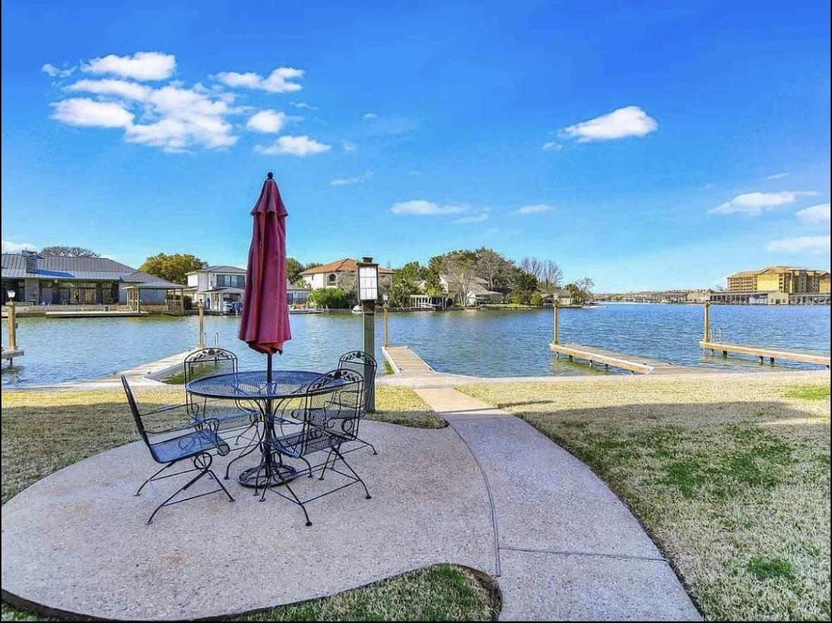 509 Short Circuit, Unit 108 Horseshoe Bay, TX 78657 - Photo 9 of 22 a view of a lake and a chairs