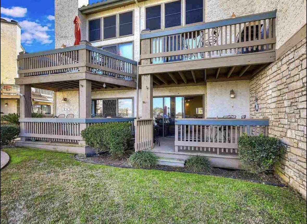 509 Short Circuit, Unit 108 Horseshoe Bay, TX 78657 - Photo 10 of 22 a view of a house with a yard and deck