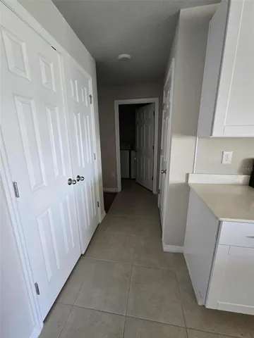 a view of a storage & utility room with a sink