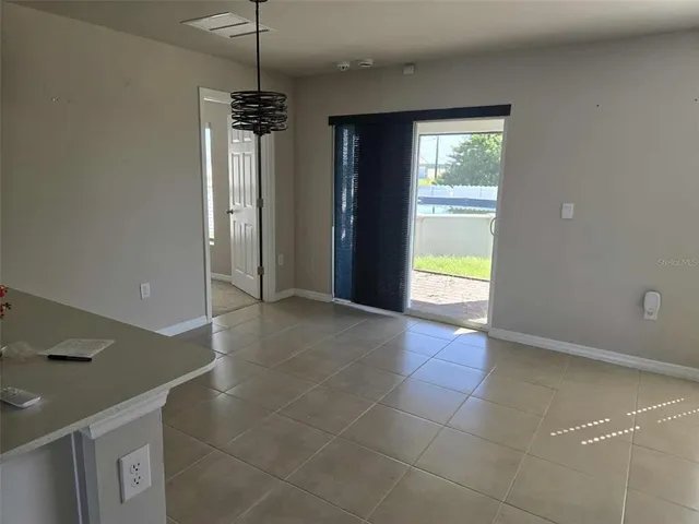 a view of a kitchen with a sink and a window