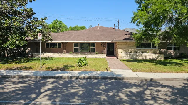 a view of house with outdoor space and swimming pool