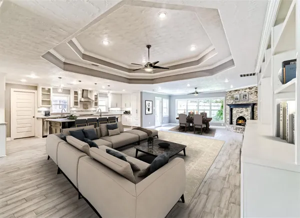 a living room with furniture and a fireplace