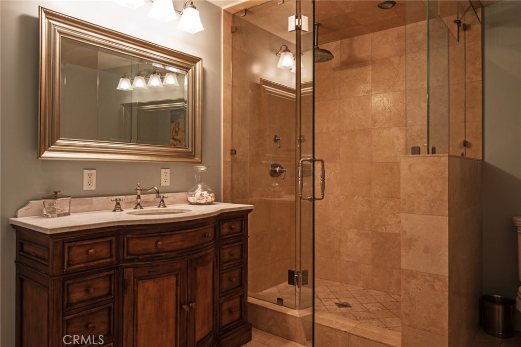 2515 Boulder Road Altadena, CA 91001 - Photo 39 of 51 a bathroom with a sink mirror and a shower
