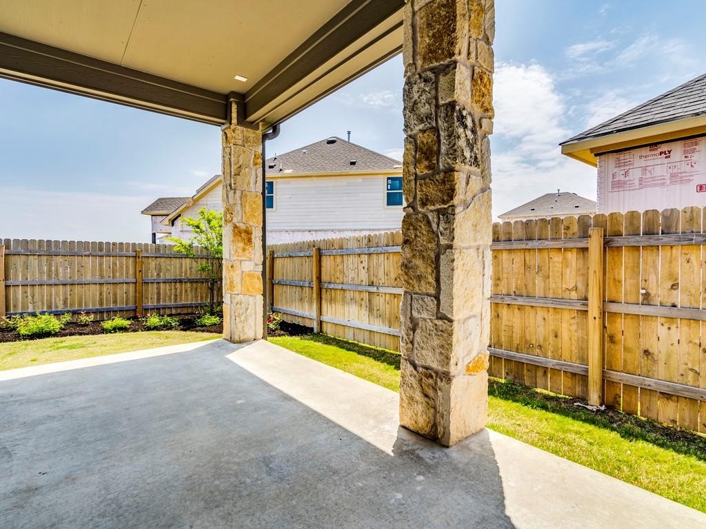 4210 Birdwatch Loop, Unit 2 Pflugerville, TX 78660 - Photo 24 of 31 Enjoy outdoor living with a covered patio and a private fenced yard.