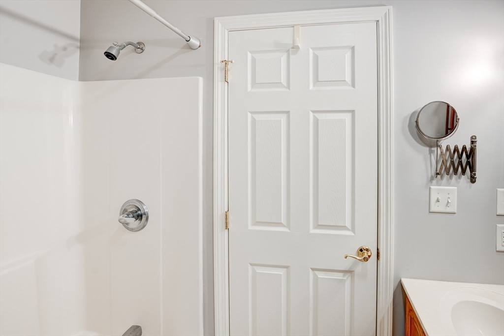 900 Lawrence Street, Unit 5 Lowell, MA 01852 - Photo 20 of 41 a bathroom with a shower