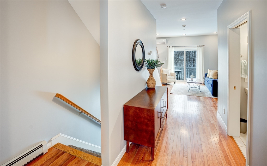900 Lawrence Street, Unit 5 Lowell, MA 01852 - Photo 21 of 41 wooden floor in a gallery
