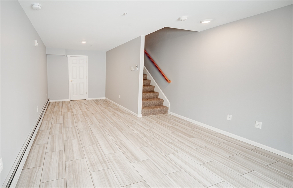 900 Lawrence Street, Unit 5 Lowell, MA 01852 - Photo 25 of 41 a view of entryway with wooden floor