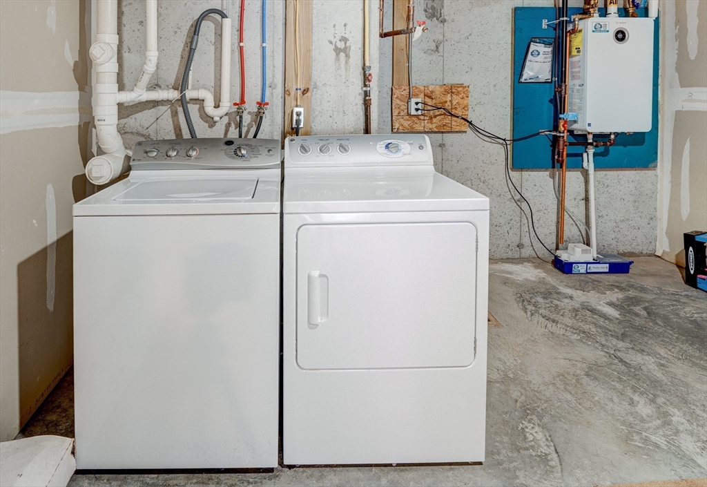 900 Lawrence Street, Unit 5 Lowell, MA 01852 - Photo 26 of 41 a utility room with dryer and washer