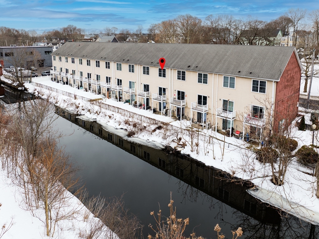 900 Lawrence Street, Unit 5 Lowell, MA 01852 - Photo 33 of 41 a view of building with yard and ocean view