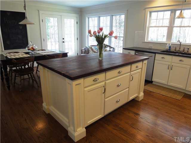 2020 Corberrie Lane Raleigh, NC 27613 - Photo 4 of 15 Huge Butcher Block Island with cabinets and seating for two Kitchen