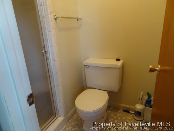 378 West Manchester Road Spring Lake, NC 28390 - Photo 7 of 25 a white toilet sitting next to a shower