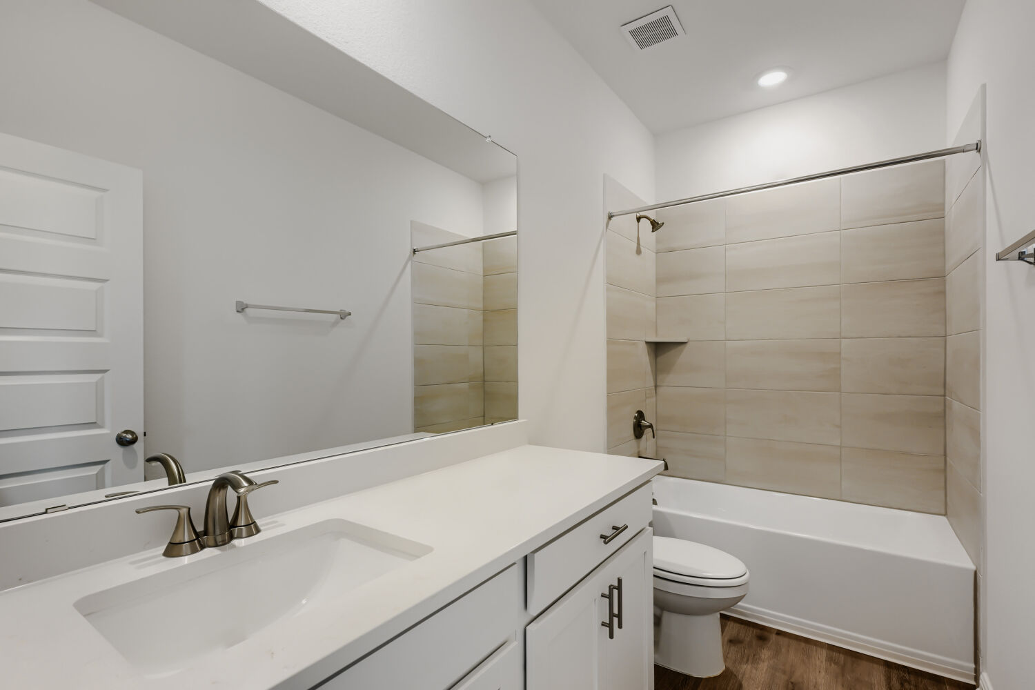 146 Diablo Rim Terrace Dripping Springs, TX 78620 - Photo 25 of 32 A well-appointed bathroom offers clean lines and contemporary finishes, featuring a crisp white vanity and modern fixtures.