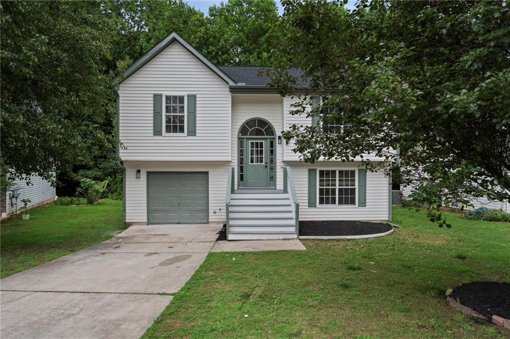 3602 Bristol Overlook Rex, GA 30273 - Photo 1 of 37 a front view of a house with a garden