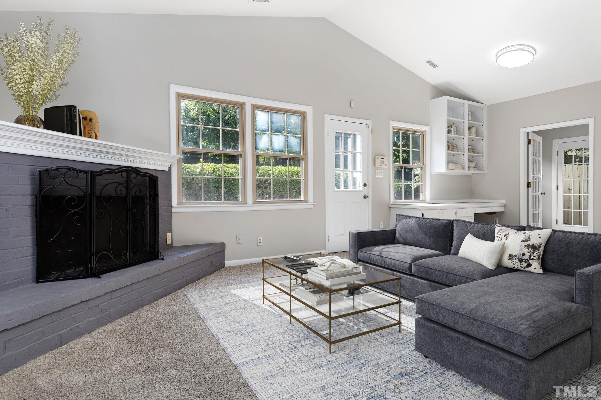 817 Chatham Lane Raleigh, NC 27610 - Photo 11 of 33 a living room with furniture and a fireplace