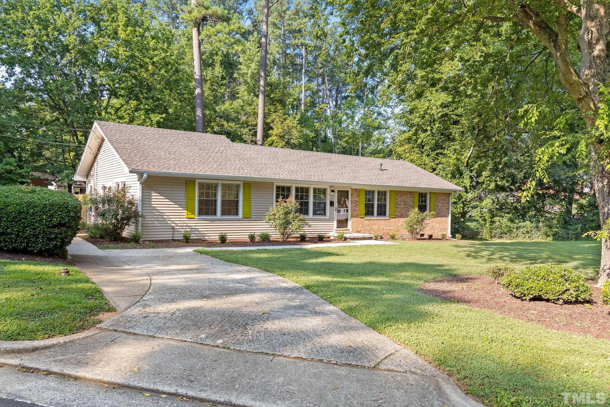 817 Chatham Lane Raleigh, NC 27610 - Photo 2 of 33 a front view of a house with garden and porch