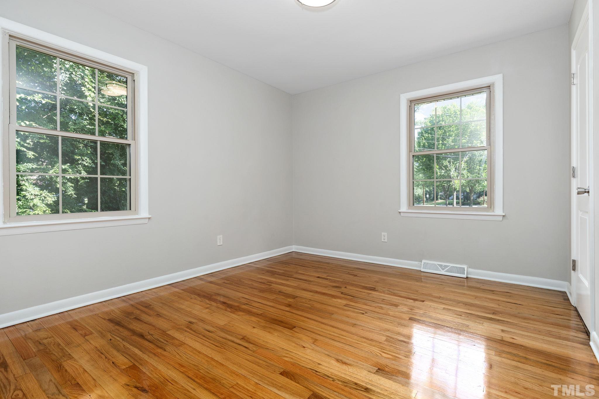 817 Chatham Lane Raleigh, NC 27610 - Photo 23 of 33 a view of a room with wooden floor and windows