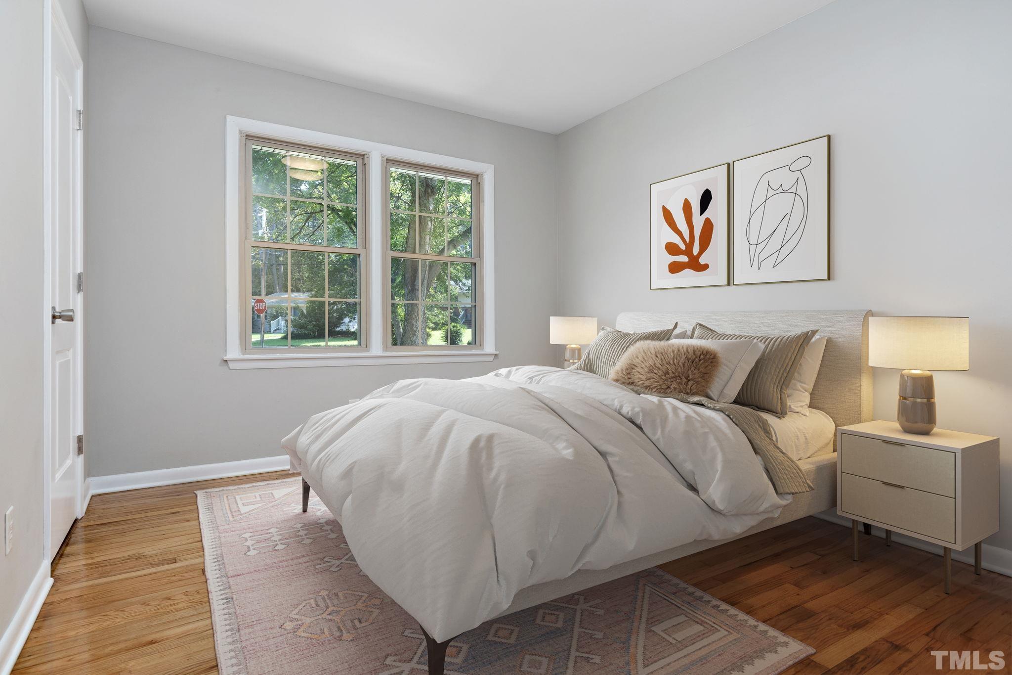 817 Chatham Lane Raleigh, NC 27610 - Photo 28 of 33 a bed sitting in a bedroom next to a window
