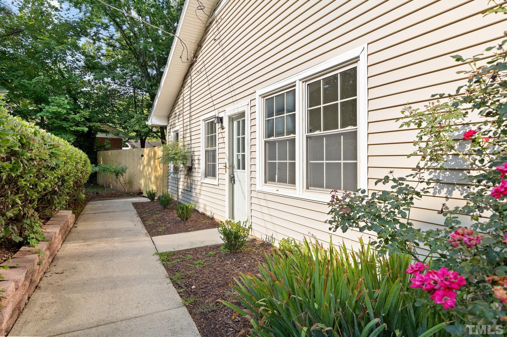 817 Chatham Lane Raleigh, NC 27610 - Photo 4 of 33 a front view of a house with a garden