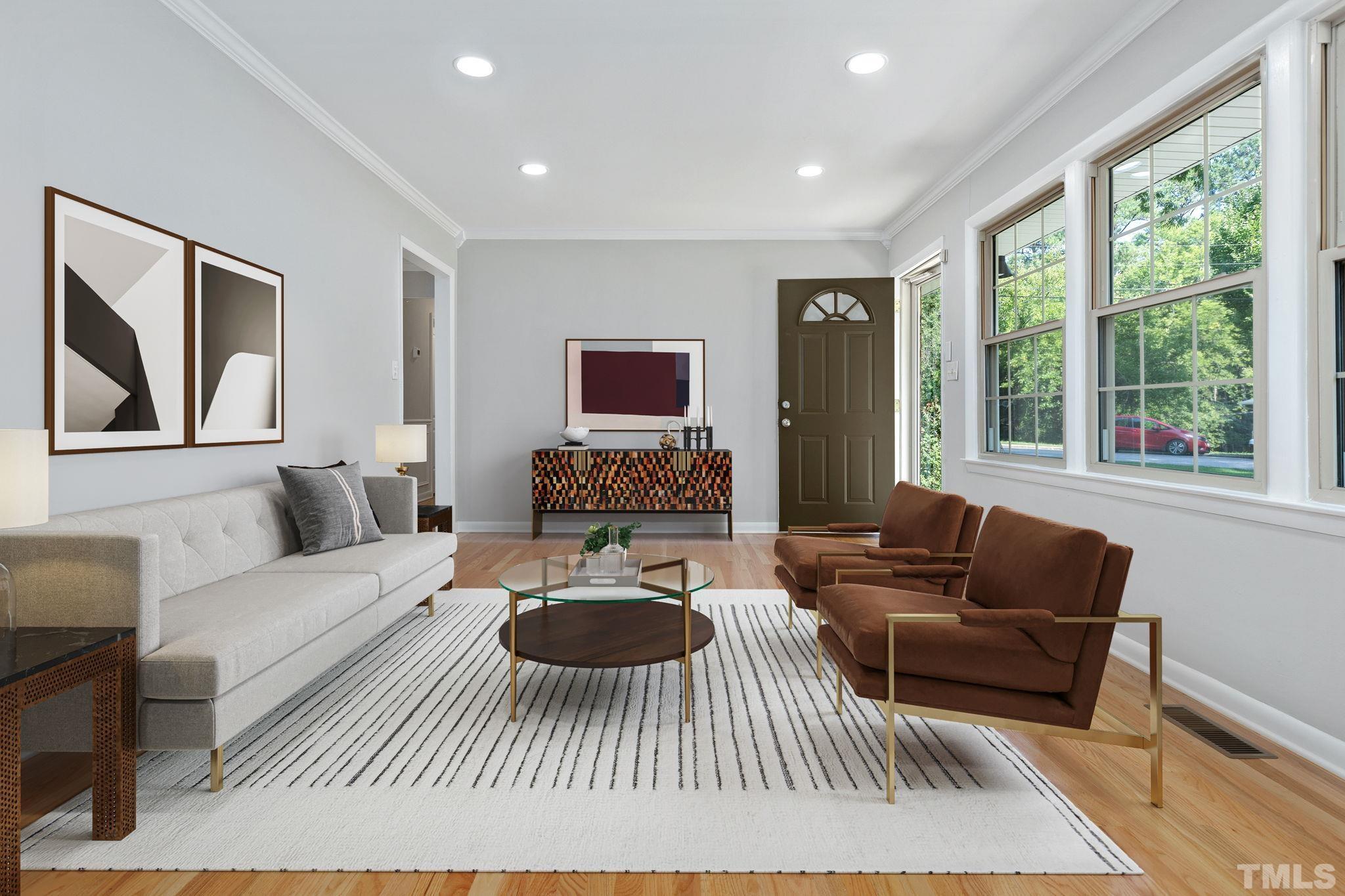 817 Chatham Lane Raleigh, NC 27610 - Photo 7 of 33 a living room with furniture and a large window