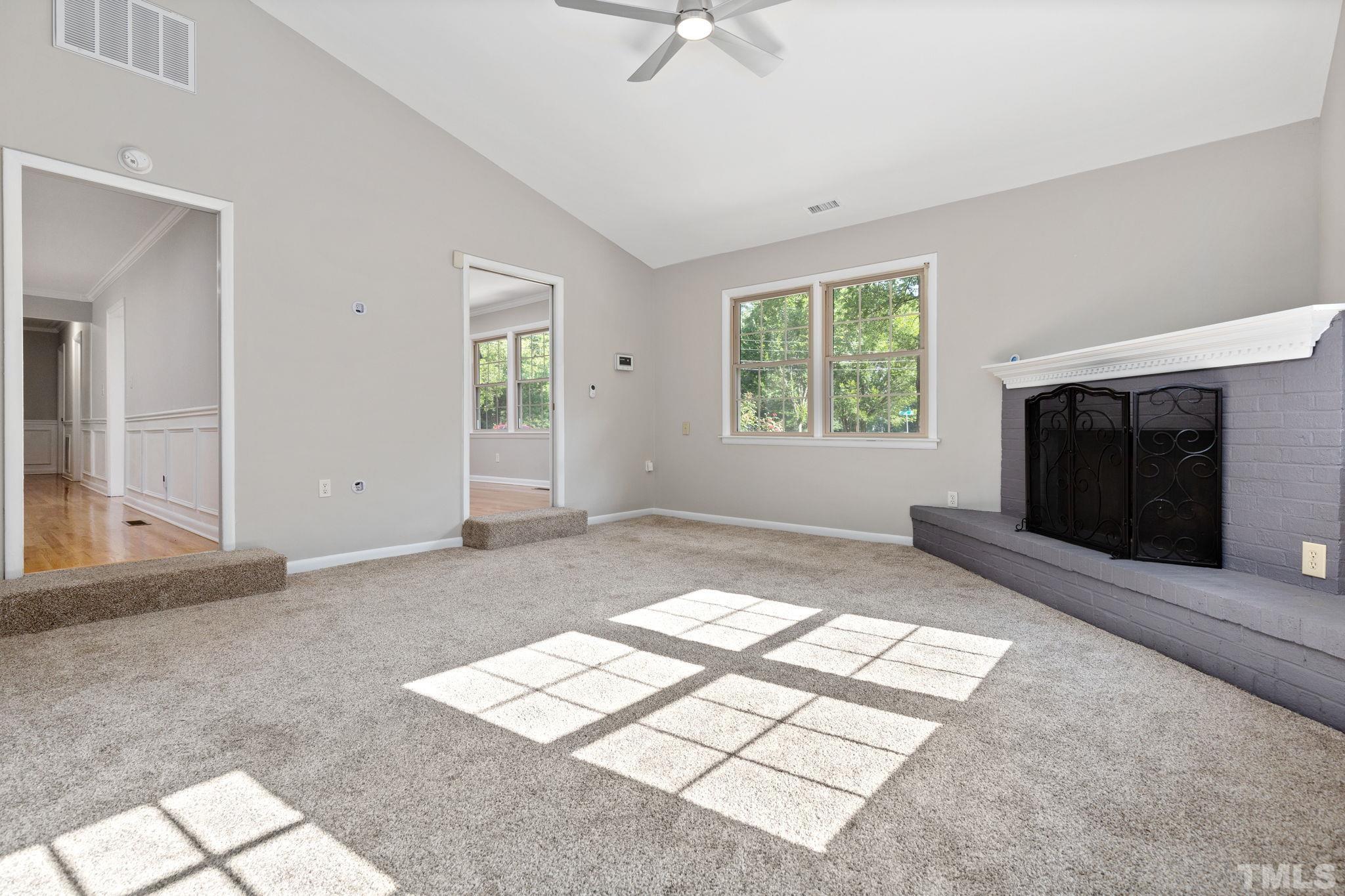 817 Chatham Lane Raleigh, NC 27610 - Photo 9 of 33 a view of livingroom with window fireplace and windows