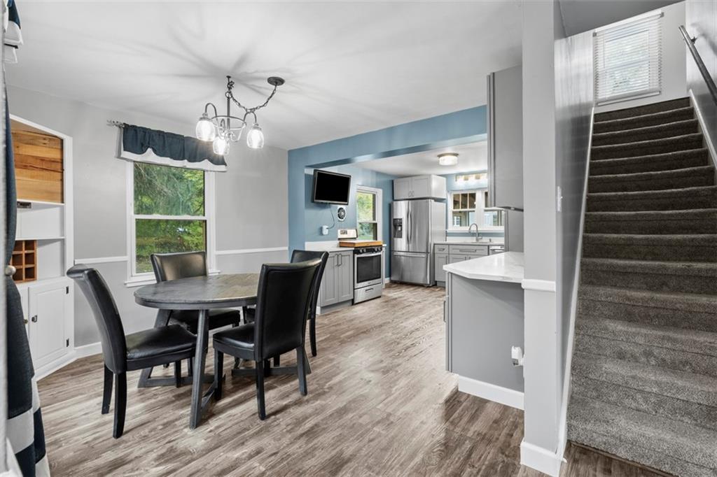 3855 Tuscarawas Road Beaver, PA 15009 - Photo 11 of 45 a view of a dining room with furniture window and wooden floor