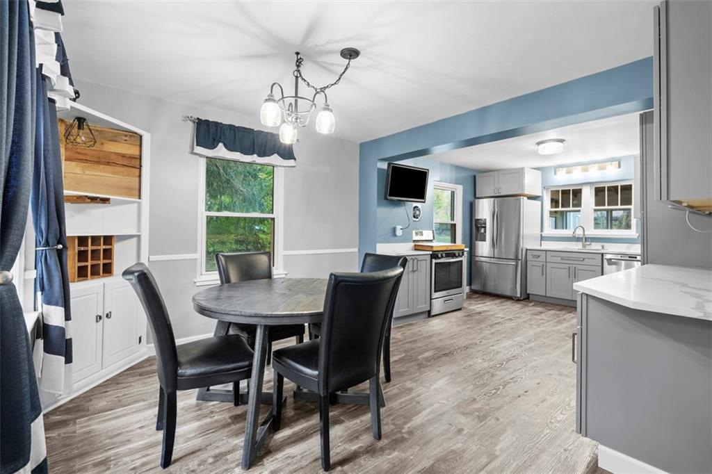 3855 Tuscarawas Road Beaver, PA 15009 - Photo 12 of 45 a view of a dining room with furniture window and wooden floor