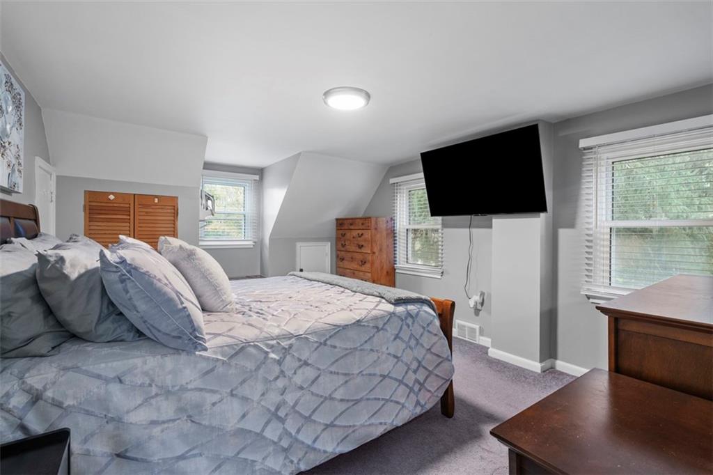 3855 Tuscarawas Road Beaver, PA 15009 - Photo 22 of 45 a bedroom with a bed and a flat screen tv