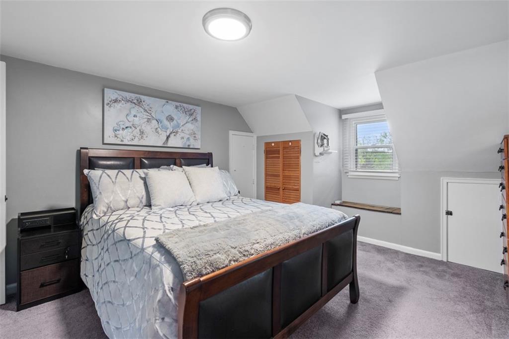 3855 Tuscarawas Road Beaver, PA 15009 - Photo 23 of 45 a bed sitting in a bedroom next to a window