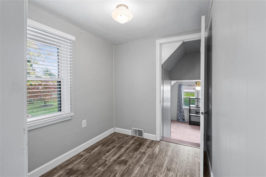 3855 Tuscarawas Road Beaver, PA 15009 - Photo 28 of 45 a view of hallway with window and wooden floor