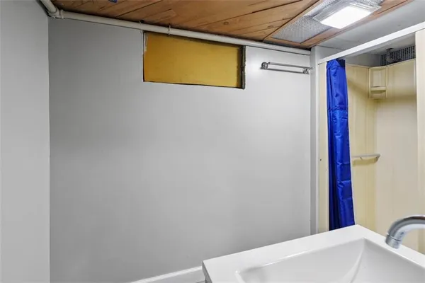 a bathroom with a bathtub and shower
