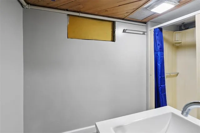 a bathroom with a bathtub and shower