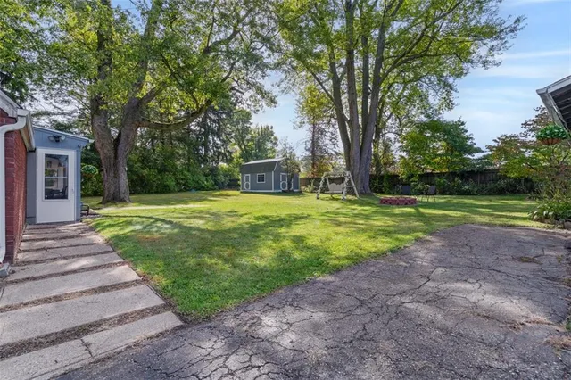 a view of a park with large trees