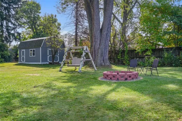 a view of a backyard with a small cabin