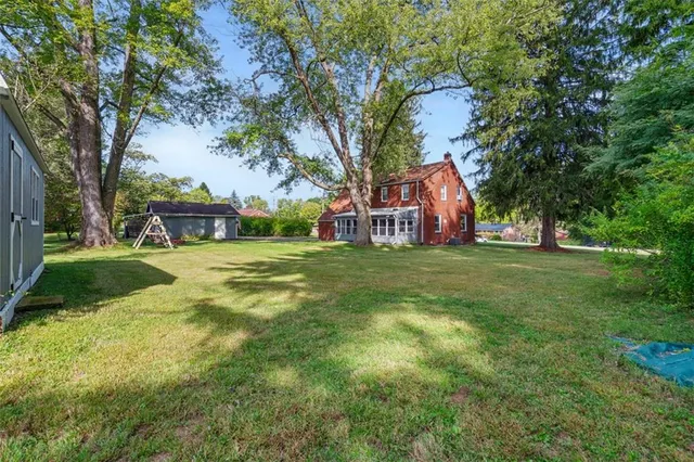 a view of a trees in front of a house