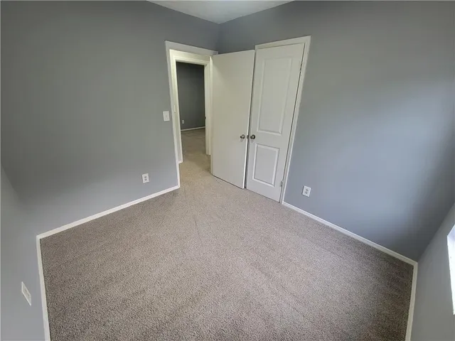 a bathroom with a toilet sink and shower