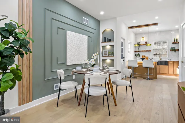 a kitchen with stainless steel appliances a stove a sink and a refrigerator