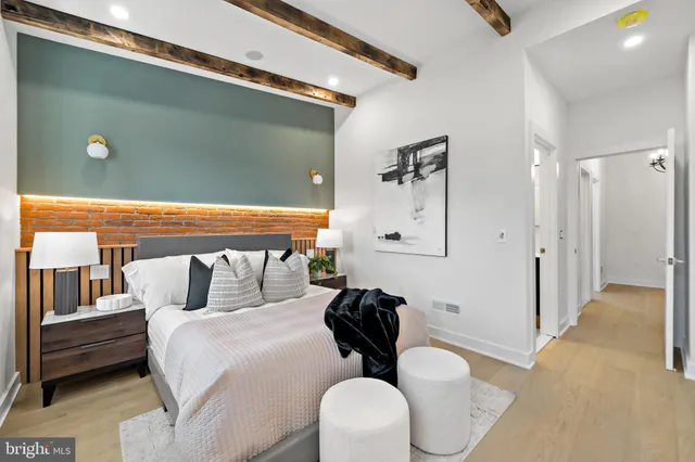 a living room with furniture a clock and a window