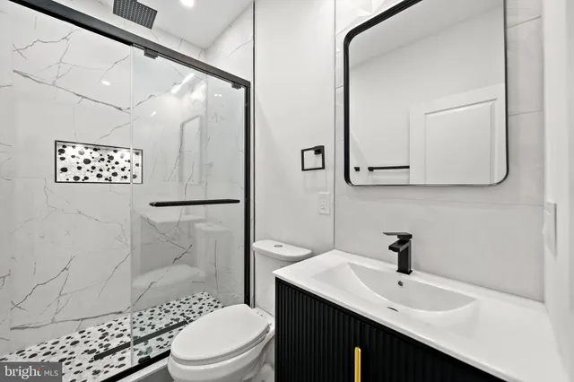 a bedroom with a bed and a mirror