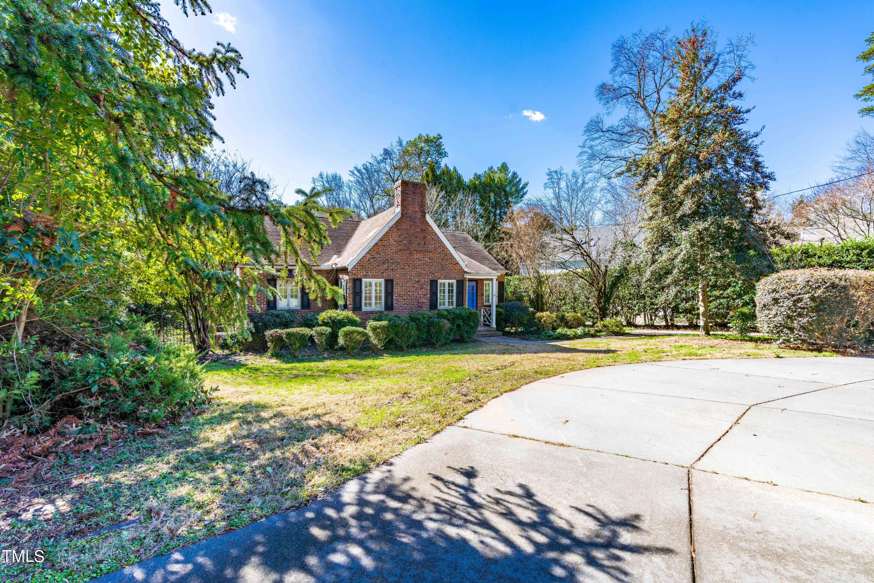 903 Lake Boone Trail Raleigh, NC 27607 - Photo 2 of 25 a front view of house with yard and trees in the background